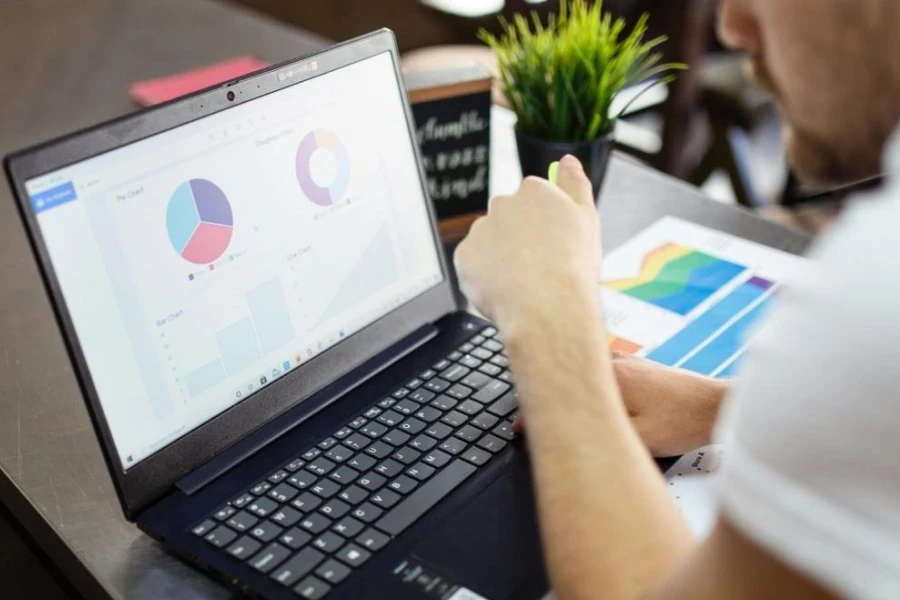 Person Using Black Laptop on Table