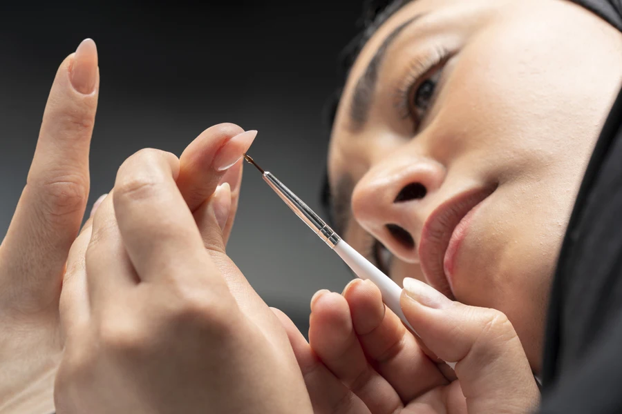 Person removing acrylic nails