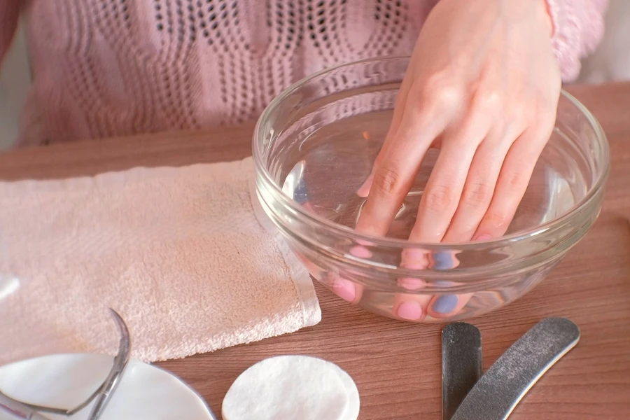 Person soaking nails in acetone