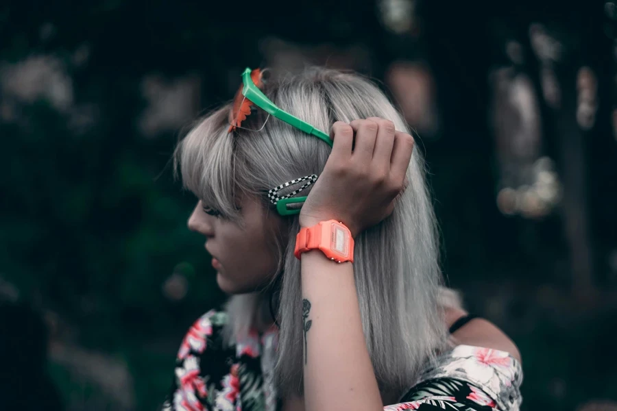 Photo Of Woman Wearing Orange Watch