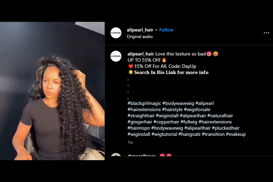 Screenshot of a black woman flaunting a waist-length curly wig