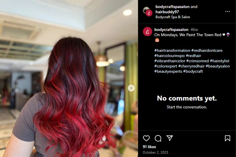 Screenshot of a lady flaunting a cherry ombre wig