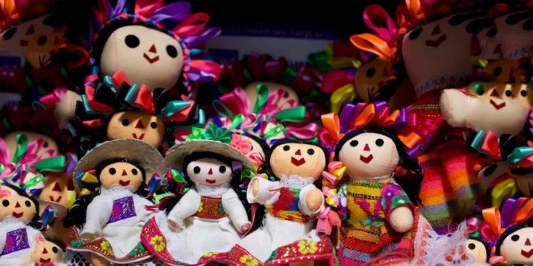 Selection of small brightly dressed souvenir dolls