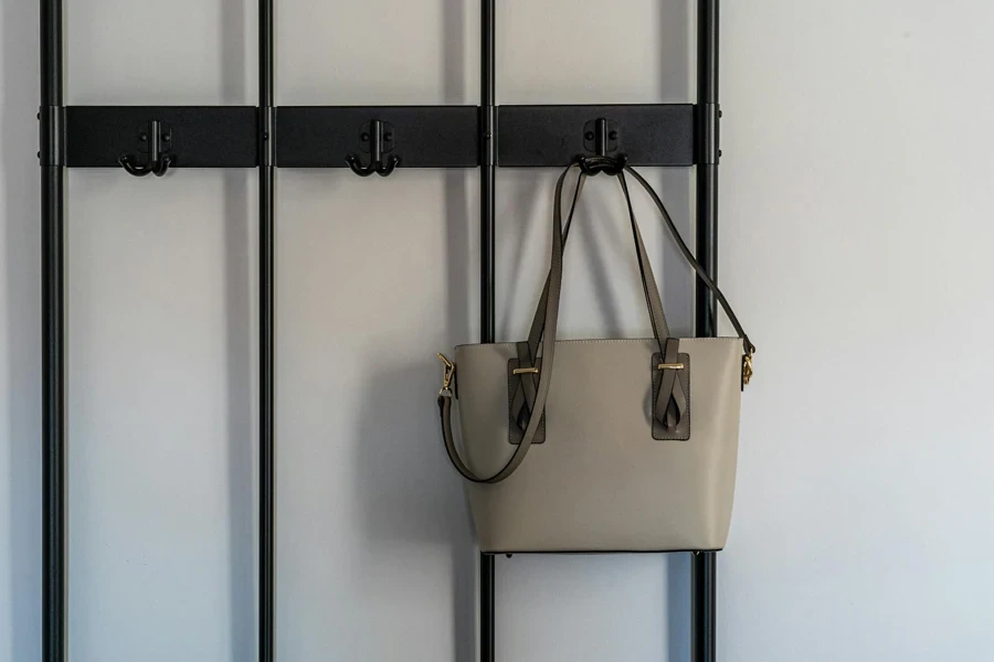 Sling Bag Hanging on Black Metal Holder