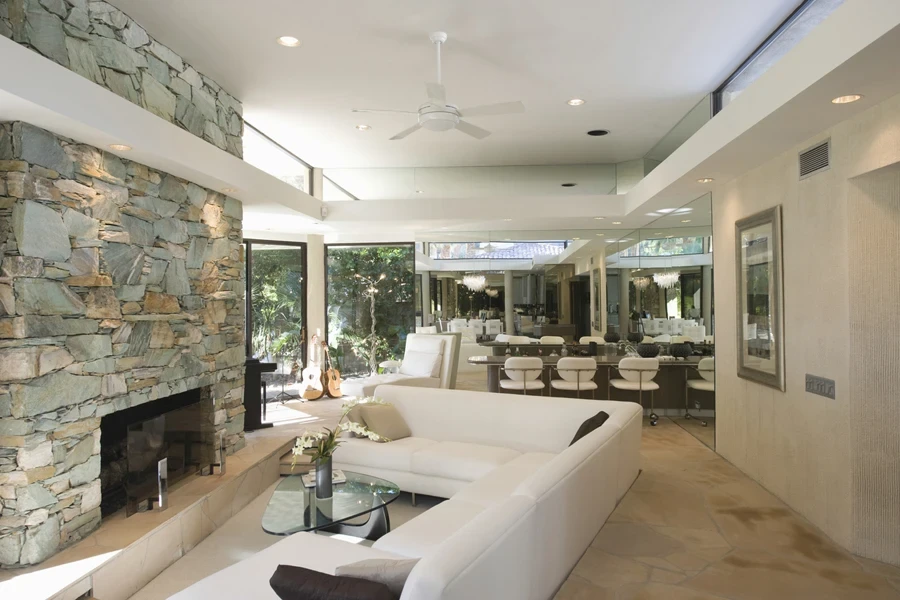 Sunken seating area and fireplace with dining area in background