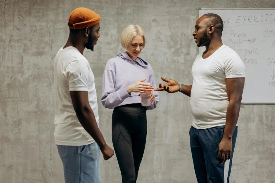 Three People Relaxing After Workout