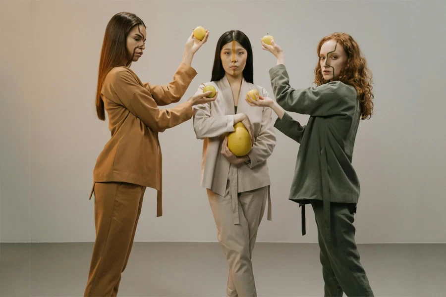 Three women in casual suits in neutral colors