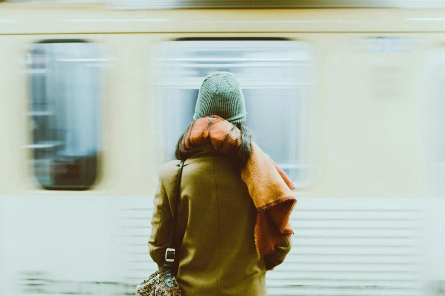 Time-Lapse Photography of Person Standing Near Train