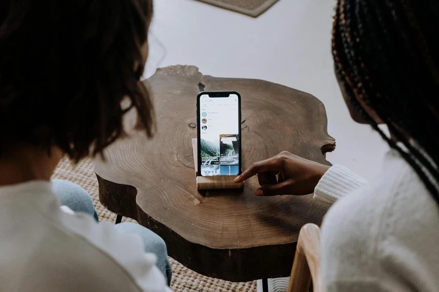 Two ladies watching a post on TikTok