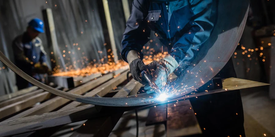 Welder working in workshop