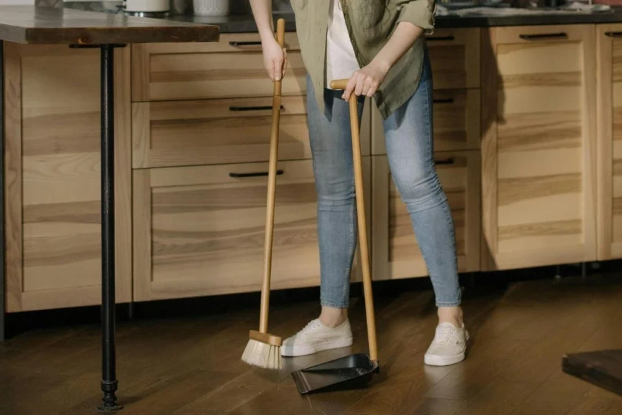 Woman Cleaning with Broom