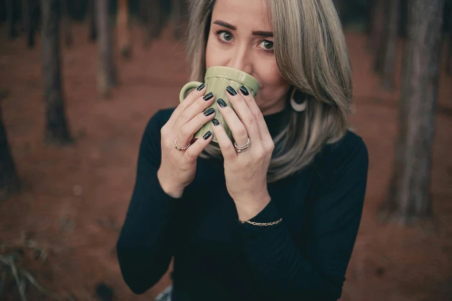 Woman Holding Grey Ceramic Mug