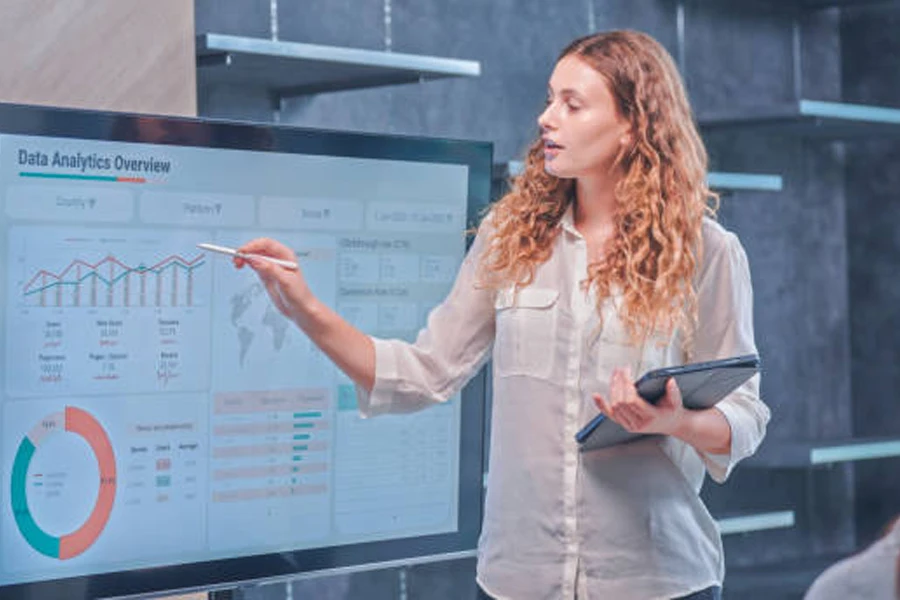 Woman analyzing data on a large screen