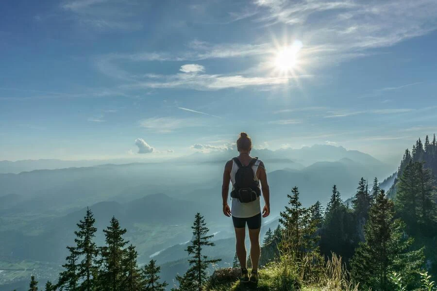 Woman carrying a small, lightweight daypack