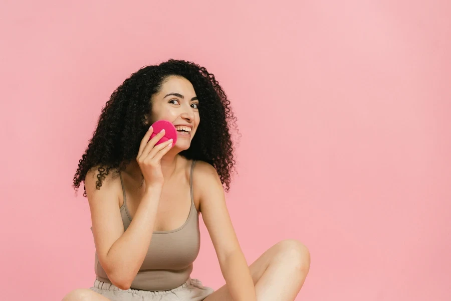 Woman cleaning her face