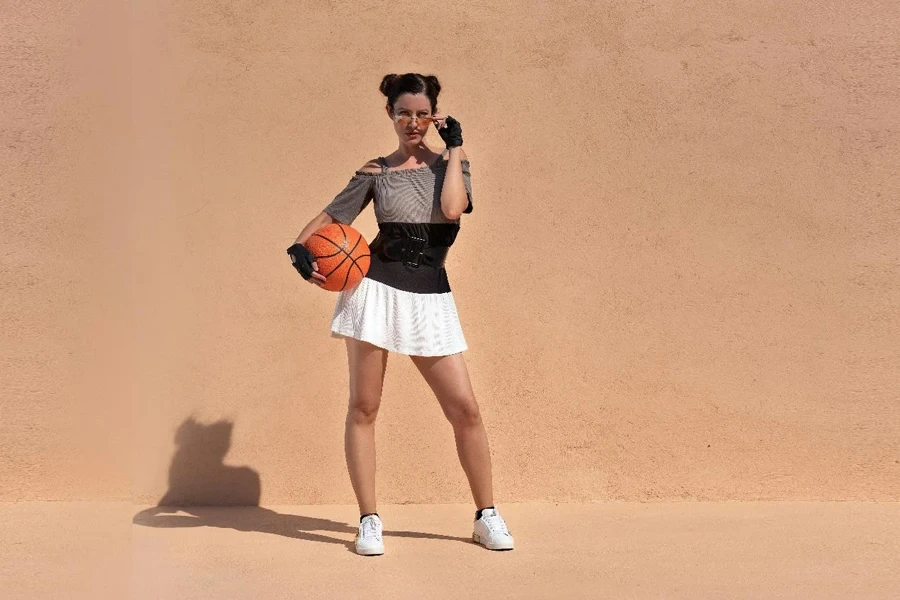 Woman in Miniskirt Posing with Ball