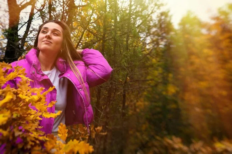 Woman in hot pink cropped puffer