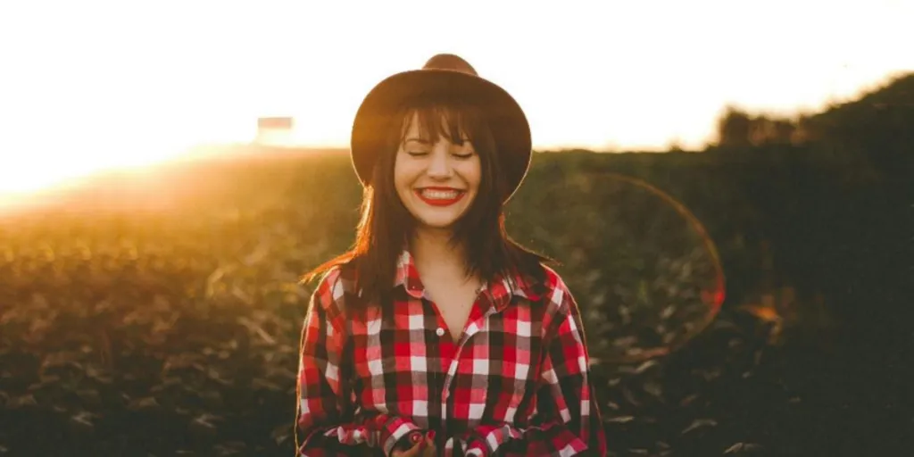 Woman in red checkered button-up shirt