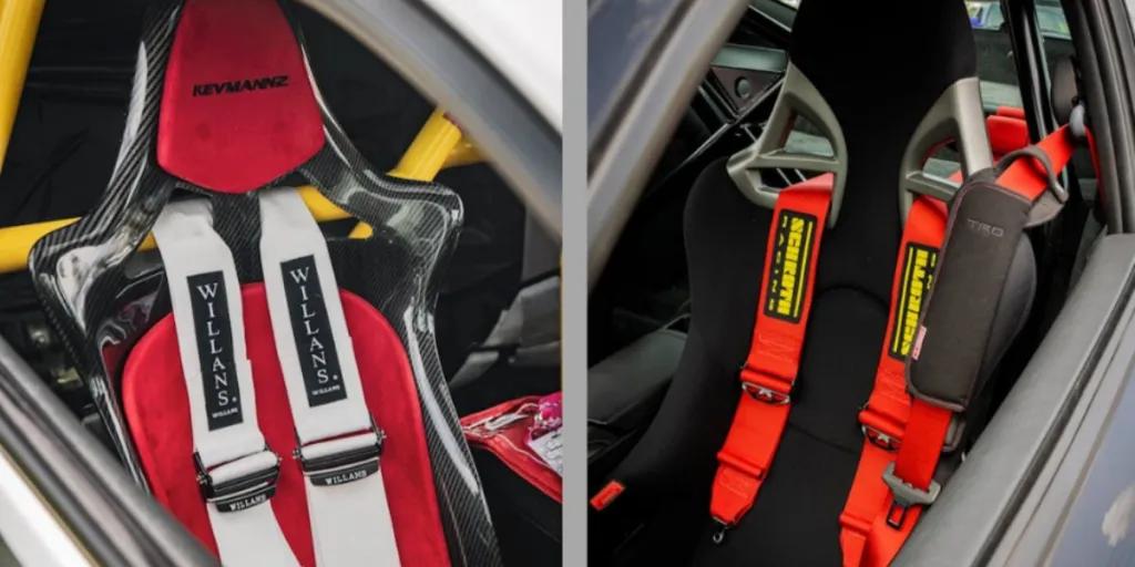 a black racing car seat with red harness