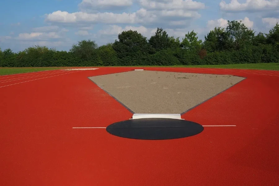 A black throwing circle on a wide field