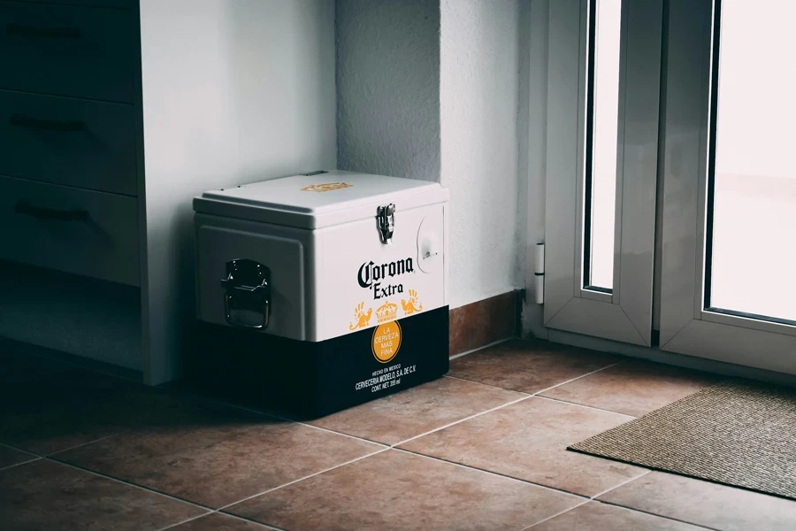 a cooler sitting on the floor next to a window