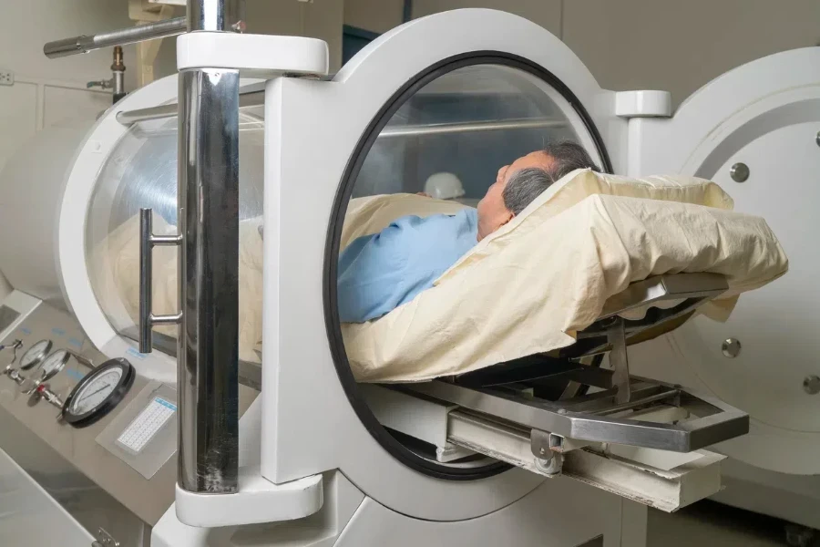 A man receiving hyperbaric oxygen therapy in a hospital