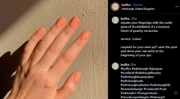 A person showcasing peach melba nails