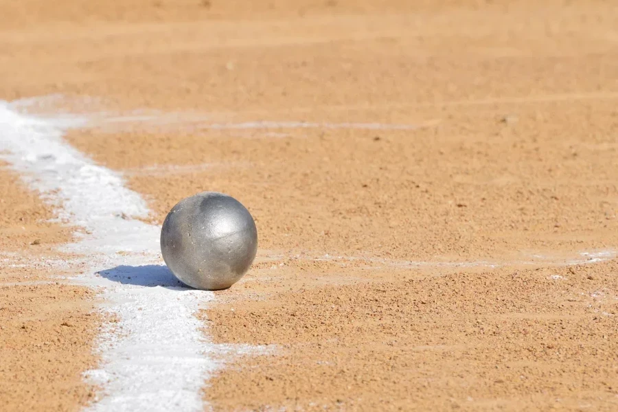 A shot put ball near a chalk line