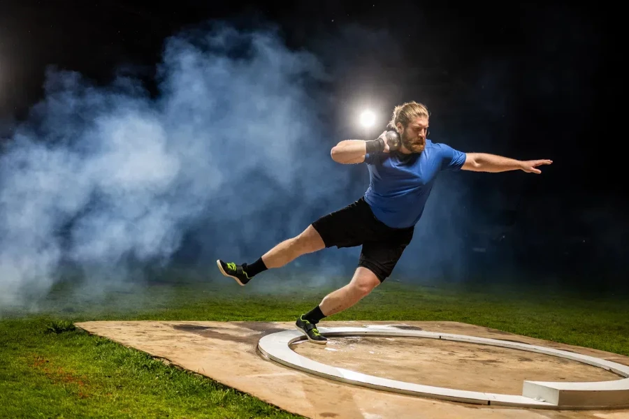 A shotput athlete wearing shoes