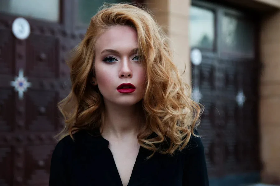 A woman posing outdoors in climate-proof makeup