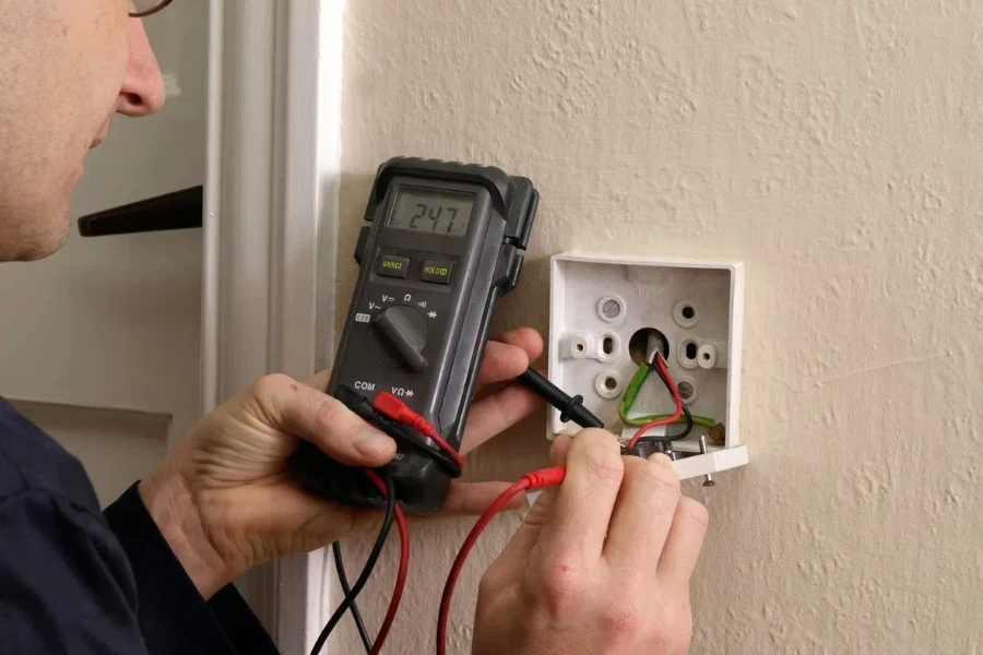 Electrician testing a light circuit