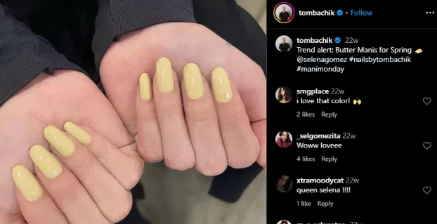 Hands showing off beautiful butter yellow nails