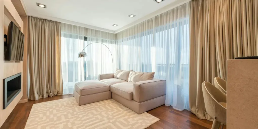 living room designed with neutral curtains and furniture