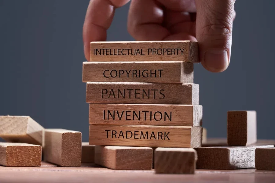 Man adding blocks showing different intellectual property protection