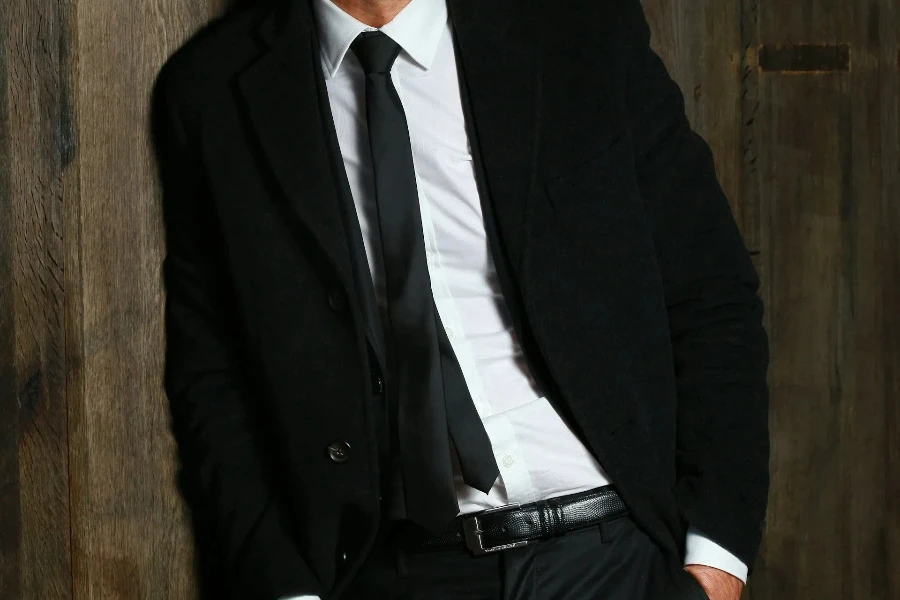 Man wearing black slim tie