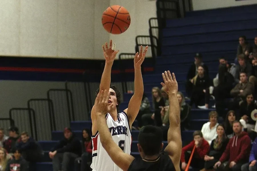 Men playing size 7 basketball on the court