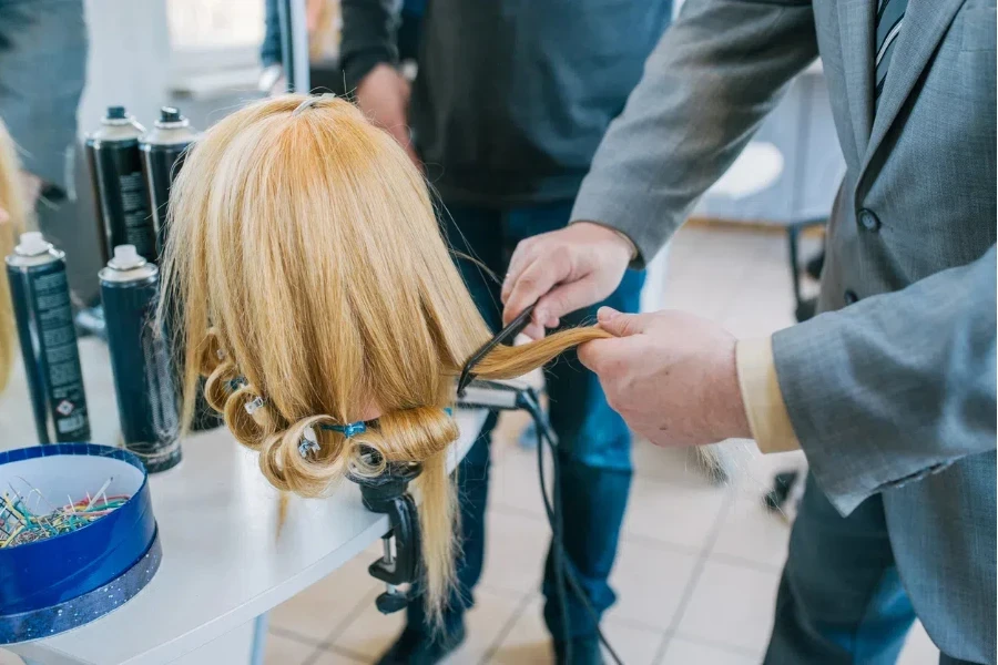 Person is a suit brushing a wig