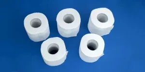 rolls of toilet paper on a blue background