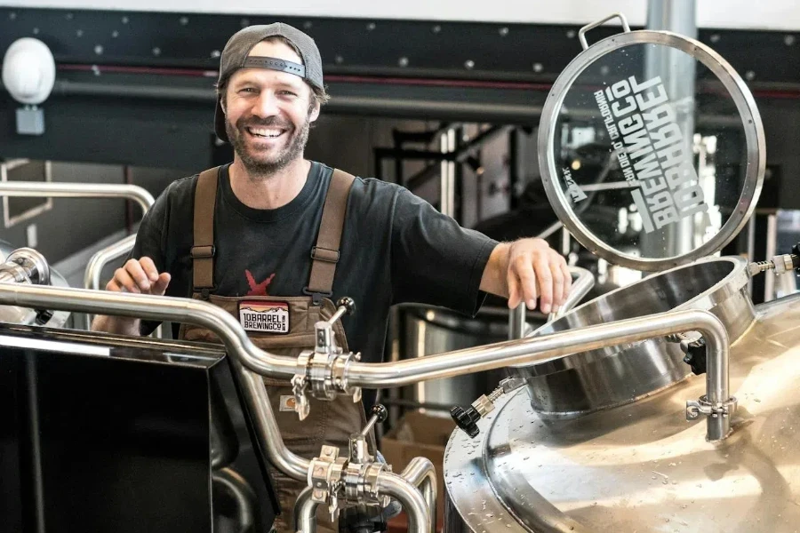 Smiling man standing near capital equipment