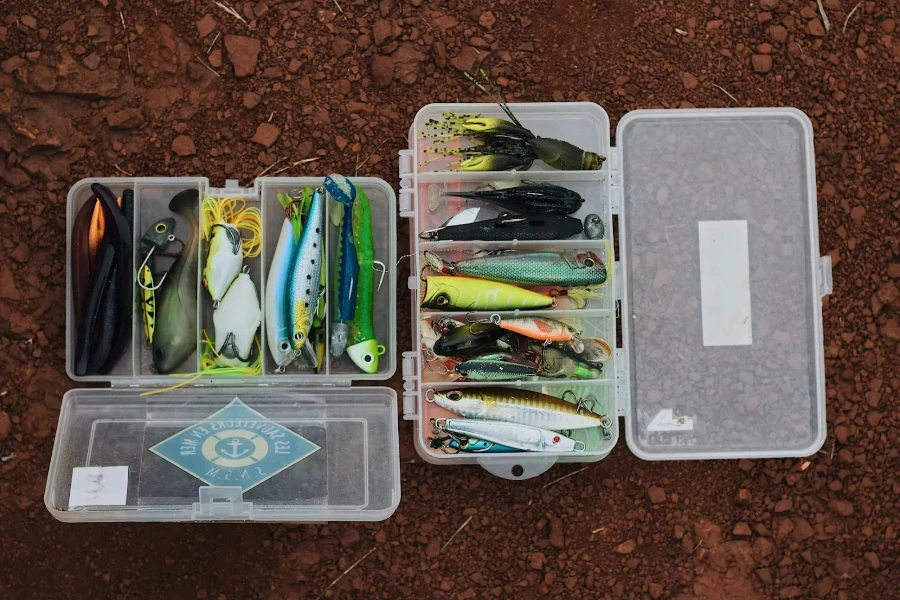 Two clear tackle boxes with various fishing lures inside