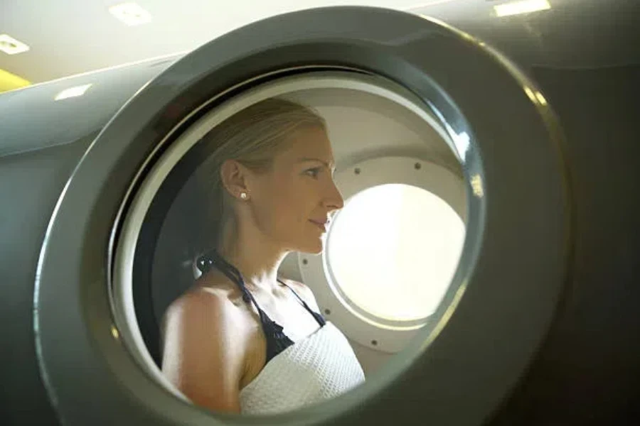 Woman in a vertical hyperbaric chamber