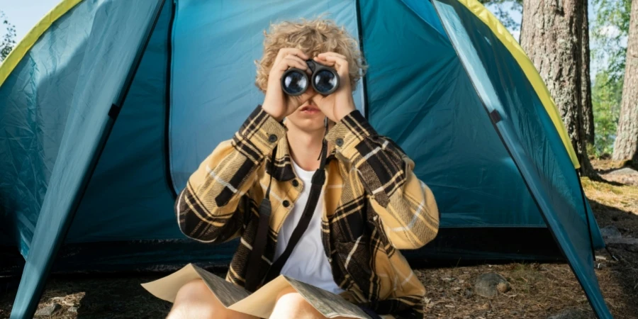 A Teenager Looking Through the Binoculars