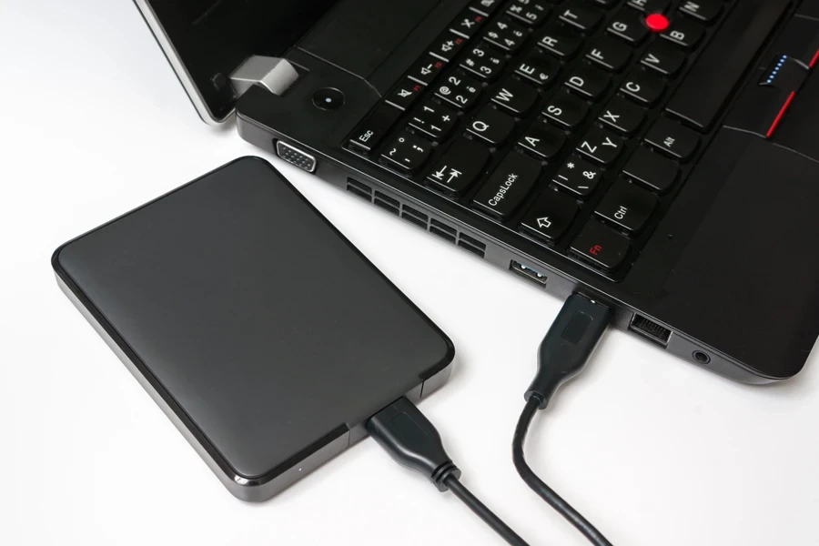 A black HDD enclosure and a dark surface