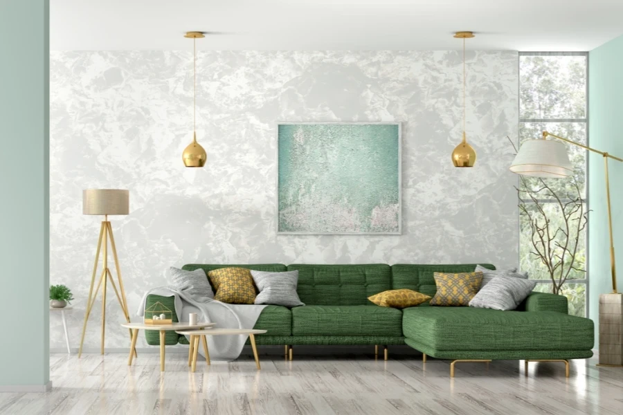 A sage green couch against a gray wall