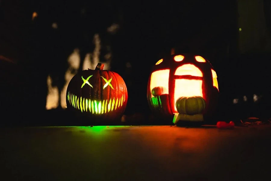 A scary face and haunted house pumpkin carving