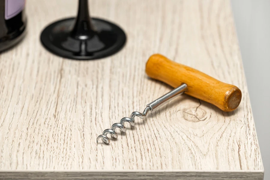 A vintage pocket corkscrew on a table