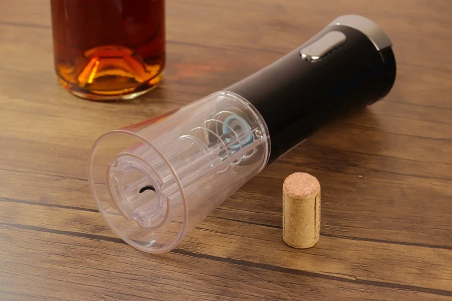 An electric corkscrew on a table