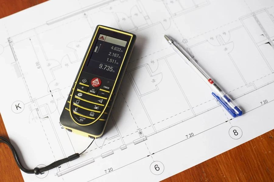 Architectural blueprint with laser distance meter