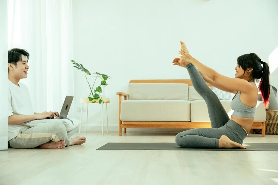 Asian couple sitting on floor