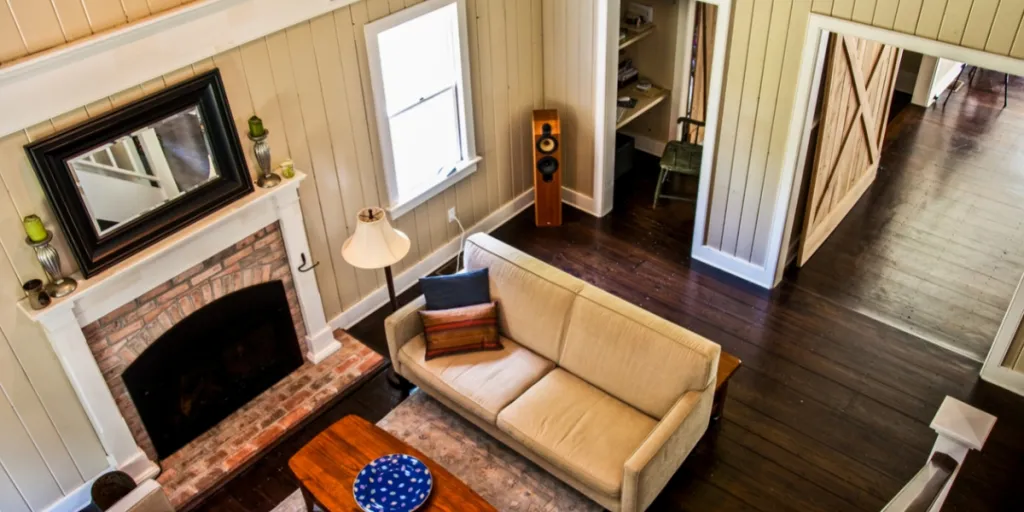 Barn style living room with beadboard up to the ceiling